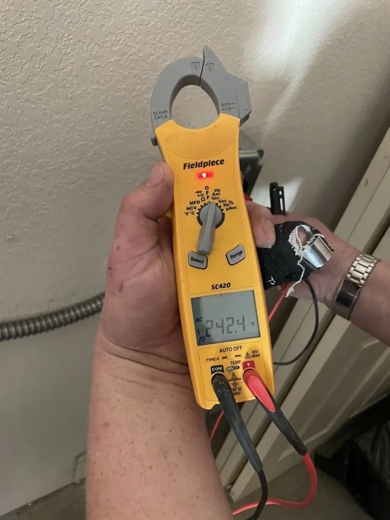 Voltage testing with clamp meter during Generator Installation in Cape Coral